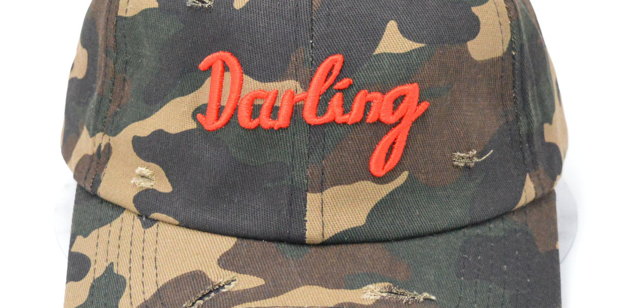camo-darling-cap-farmer-by-whitney-1_1200x_397c9192-629f-45e7-9aaf-32a348d81d1b.png